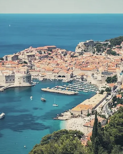 An old walled town and harbour seen from above
